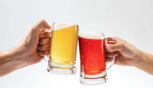 men-toasting-with-beer-on-white-background